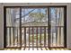 Balcony with a view of a pond with fountain and trees at 23310 Plantation Dr, Atlanta, GA 30324