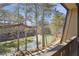 Balcony with a view of a pond, fountain, trees and residences at 23310 Plantation Dr, Atlanta, GA 30324