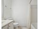 Clean bathroom featuring a shower with white tiled walls and modern fixtures at 23310 Plantation Dr, Atlanta, GA 30324