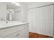 Bathroom featuring white cabinets and solid surface counter with modern lighting and fixtures at 23310 Plantation Dr, Atlanta, GA 30324