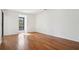 Empty bedroom with hardwood floors, a small window and sliding glass door at 23310 Plantation Dr, Atlanta, GA 30324