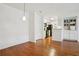 Open dining area with hardwood floors, white walls and pendant lighting fixture at 23310 Plantation Dr, Atlanta, GA 30324