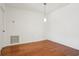 Bright dining room with hardwood floors and modern lighting at 23310 Plantation Dr, Atlanta, GA 30324