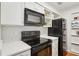 Bright kitchen featuring stainless steel appliances, white cabinets, and subway tile backsplash at 23310 Plantation Dr, Atlanta, GA 30324