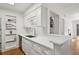 Updated kitchen features white cabinets, countertops, and stainless steel sink at 23310 Plantation Dr, Atlanta, GA 30324