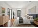 Bright main bedroom with stylish decor, hardwood floors and private balcony at 23310 Plantation Dr, Atlanta, GA 30324