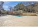 Community pool featuring a large pool deck and a building in the background at 23310 Plantation Dr, Atlanta, GA 30324