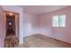 Bedroom featuring hardwood floors, a closet, and a window that brings in natural light at 301 Lady Agatha Ct, Jonesboro, GA 30236