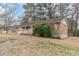 Inviting brick home boasting an attached garage and covered front porch, enhanced by mature landscaping at 301 Lady Agatha Ct, Jonesboro, GA 30236