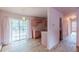 Cozy pink kitchen with natural light, classic cabinets and sliding glass doors to the backyard at 301 Lady Agatha Ct, Jonesboro, GA 30236