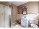 Functional bathroom with a glass shower, single vanity, and neutral color scheme at 3483 Napoleon St, Atlanta, GA 30337