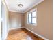 Cozy bedroom with hardwood floors, a large window and neutral walls at 3483 Napoleon St, Atlanta, GA 30337