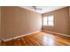 Bedroom featuring hardwood floors, a ceiling fan, and natural light at 3483 Napoleon St, Atlanta, GA 30337