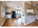 Kitchen with breakfast bar, white cabinets, and stainless steel refrigerator at 3483 Napoleon St, Atlanta, GA 30337