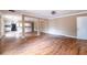 Spacious living room featuring hardwood floors, a kitchen view, and a bright, open design at 3483 Napoleon St, Atlanta, GA 30337