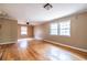 Bright living room featuring hardwood floors and natural light from large windows at 3483 Napoleon St, Atlanta, GA 30337