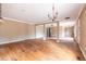 Expansive living area with hardwood floors and modern lighting fixtures throughout the space at 3483 Napoleon St, Atlanta, GA 30337