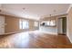 Spacious living area with hardwood floors and a view into the adjoining kitchen space at 3483 Napoleon St, Atlanta, GA 30337