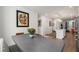 Dining room with modern table, seating, and an open view into the kitchen and living area at 383 Grant Se Cir # 1634, Atlanta, GA 30315