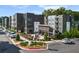 Modern apartment complex with outdoor seating area, landscaping, and parking at 383 Grant Se Cir # 1634, Atlanta, GA 30315