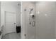 Bathroom featuring a tiled shower, glass door and gray tile flooring at 383 Grant Se Cir # 1634, Atlanta, GA 30315