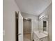 Bright bathroom featuring single vanity and tile flooring and large mirror at 640 City Park Dr, Mcdonough, GA 30252