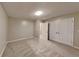 Bright bedroom featuring double door closet, neutral walls, and plush carpeting at 640 City Park Dr, Mcdonough, GA 30252