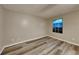 Cozy bedroom featuring hardwood floors, a window, and neutral paint, ready for personalization at 640 City Park Dr, Mcdonough, GA 30252