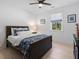 Comfortable bedroom with a bed, wood floors, window, and neutral wall color at 650 Jones Rd, Roswell, GA 30075