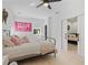 Cozy bedroom with a bed, natural light, and barn-style sliding door to en suite bathroom at 650 Jones Rd, Roswell, GA 30075