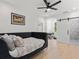 Bedroom with a daybed, ceiling fan, and barn door leading to the modern bathroom at 650 Jones Rd, Roswell, GA 30075