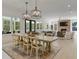 Inviting dining area features farmhouse table, modern lighting, and an open floor plan at 650 Jones Rd, Roswell, GA 30075