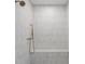 Modern shower with a built-in bench and light gray vertical stack tiled walls at 650 Jones Rd, Roswell, GA 30075