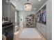 Well-organized walk-in closet featuring custom cabinets, shelving, and wood flooring at 650 Jones Rd, Roswell, GA 30075