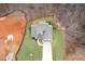 Bird's eye view of the home, showcasing the layout, landscaping, and a long driveway at 260 Harmony Woods Dr, Dallas, GA 30157