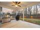 Covered back porch area with outdoor grill and sunset views at 260 Harmony Woods Dr, Dallas, GA 30157