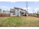 View of the home's backyard, including the covered patio, fenced yard, and landscaping at 260 Harmony Woods Dr, Dallas, GA 30157