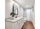 Bathroom featuring modern vanity, granite countertop, white fixtures, and tiled shower with curtain at 260 Harmony Woods Dr, Dallas, GA 30157