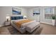 Bedroom with neutral décor, patterned rug, large window, and ample natural light at 260 Harmony Woods Dr, Dallas, GA 30157