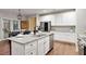 Bright kitchen featuring white cabinets, stainless steel appliances, and a granite island at 260 Harmony Woods Dr, Dallas, GA 30157