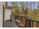 Back deck with black wood railings offering views of the surrounding wooded area at 2861 Dorby Close Ne, Brookhaven, GA 30319