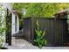 Side yard with a black fence and a back deck that allows access through a glass door at 2861 Dorby Close Ne, Brookhaven, GA 30319