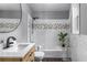 Bathroom with white subway tile, modern fixtures, and updated vanity at 2861 Dorby Close Ne, Brookhaven, GA 30319