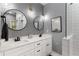 Modern bathroom with double sink vanity, stylish mirrors and a glass-enclosed shower at 2861 Dorby Close Ne, Brookhaven, GA 30319