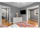 Spacious bedroom with hardwood floors and a flat screen TV at 2861 Dorby Close Ne, Brookhaven, GA 30319