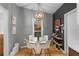 Cozy dining area featuring a modern chandelier, wood floors, and artwork at 2861 Dorby Close Ne, Brookhaven, GA 30319