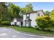 Charming two-story home with a landscaped yard, white brick, black shutters and a manicured lawn at 2861 Dorby Close Ne, Brookhaven, GA 30319