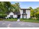 Charming two-story home with a landscaped yard, white brick, black shutters and a manicured lawn at 2861 Dorby Close Ne, Brookhaven, GA 30319