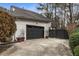 Home featuring a large driveway leading up to a two-car garage at 2861 Dorby Close Ne, Brookhaven, GA 30319