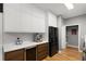 Modern kitchen featuring stainless steel appliances, a wine fridge, and ample counter space at 2861 Dorby Close Ne, Brookhaven, GA 30319
